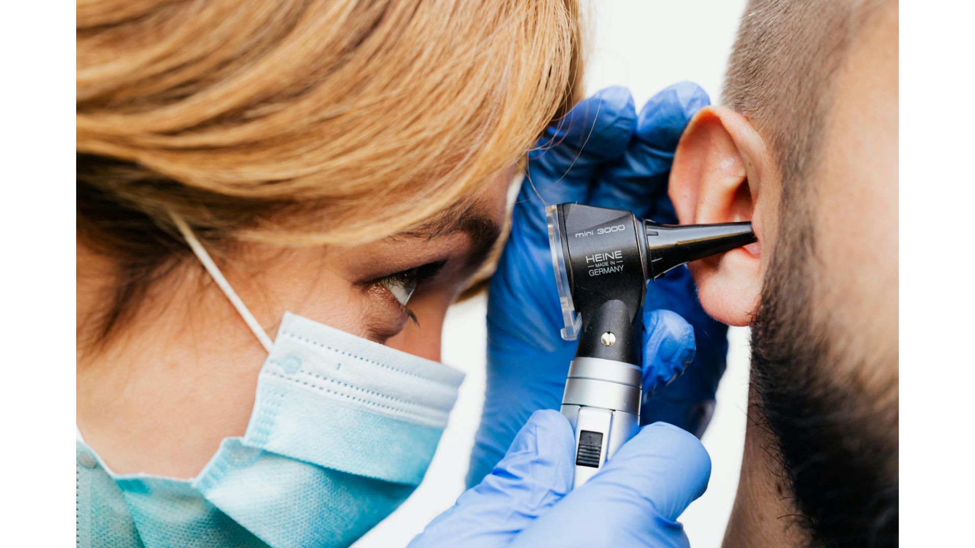 nurse looking in ear